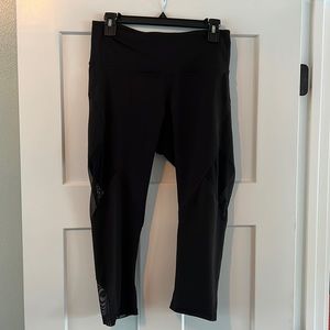 Large calf length yoga pants with sheer cutouts along the legs. Old Navy